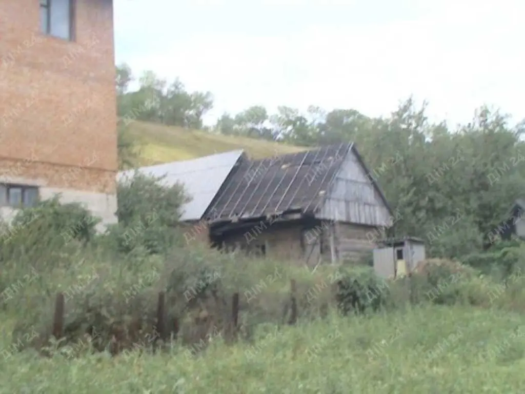 Ділянка з будинком в с.Коломак за Абазівкою.