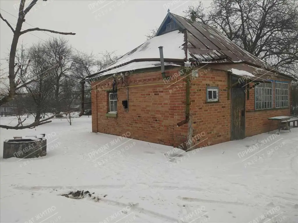 Ділянка з будинком під знос